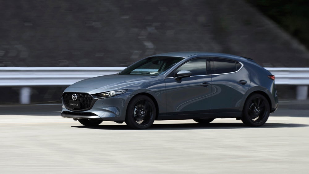 A 2025 Mazda3 Hatchback on a road