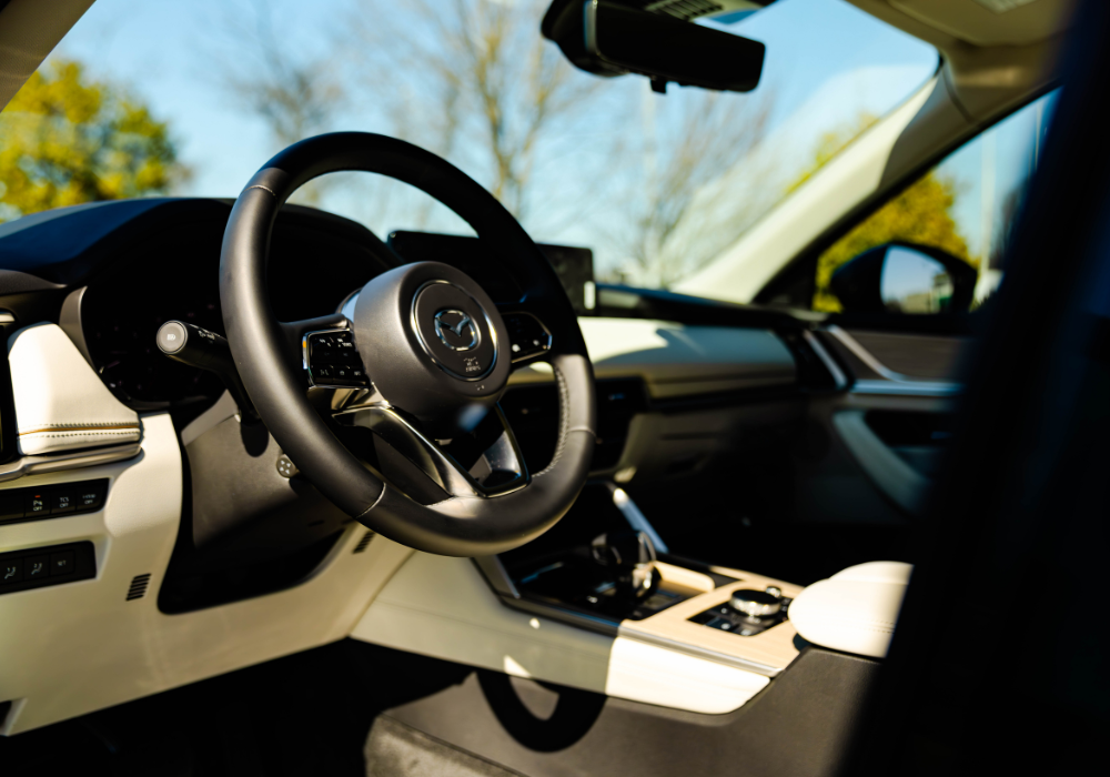 Mazda CX-90 interior, including the steering wheel and front dash