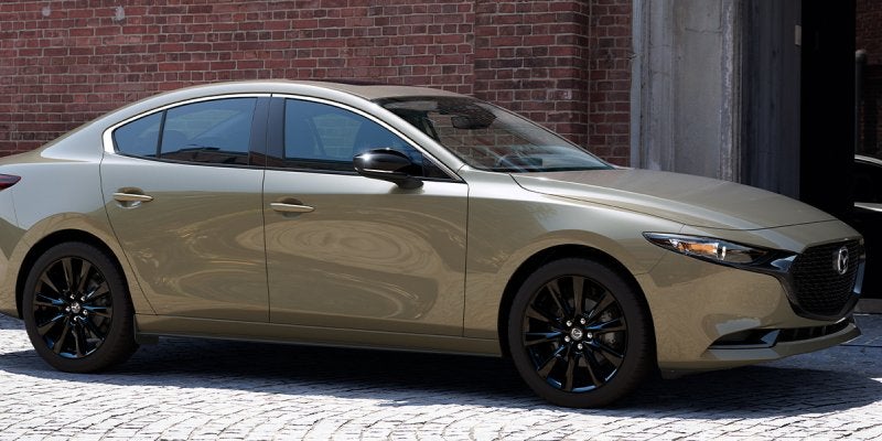 A 2025 Mazda3 Sedan Carbon Edition on a road